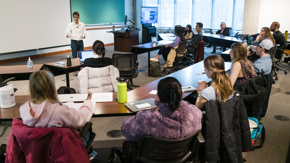 Gupta teacing in front of students