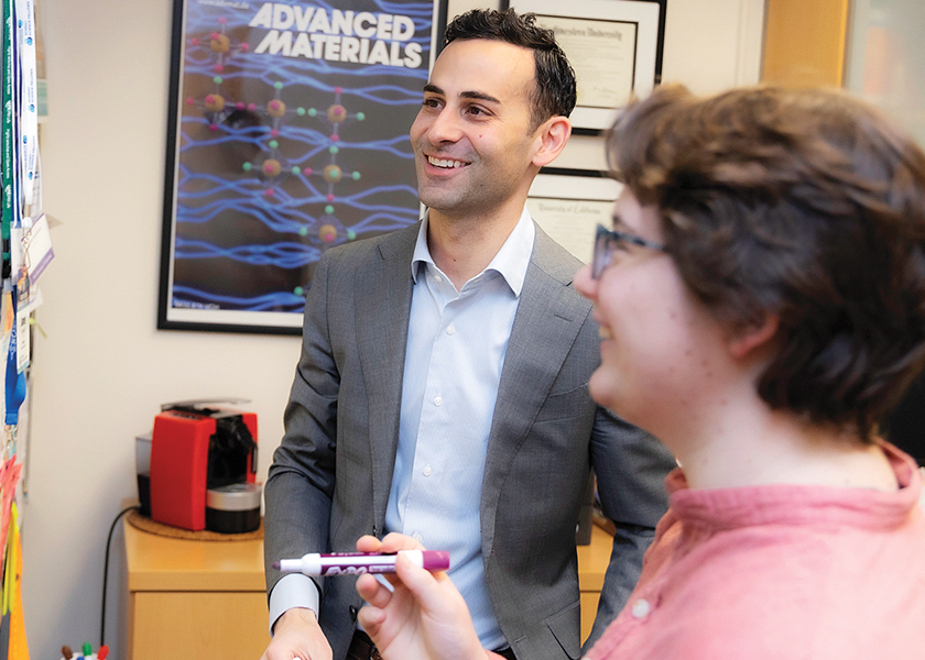 James Rondinelli discusses research ideas with materials science PhD student Megan Burrill.