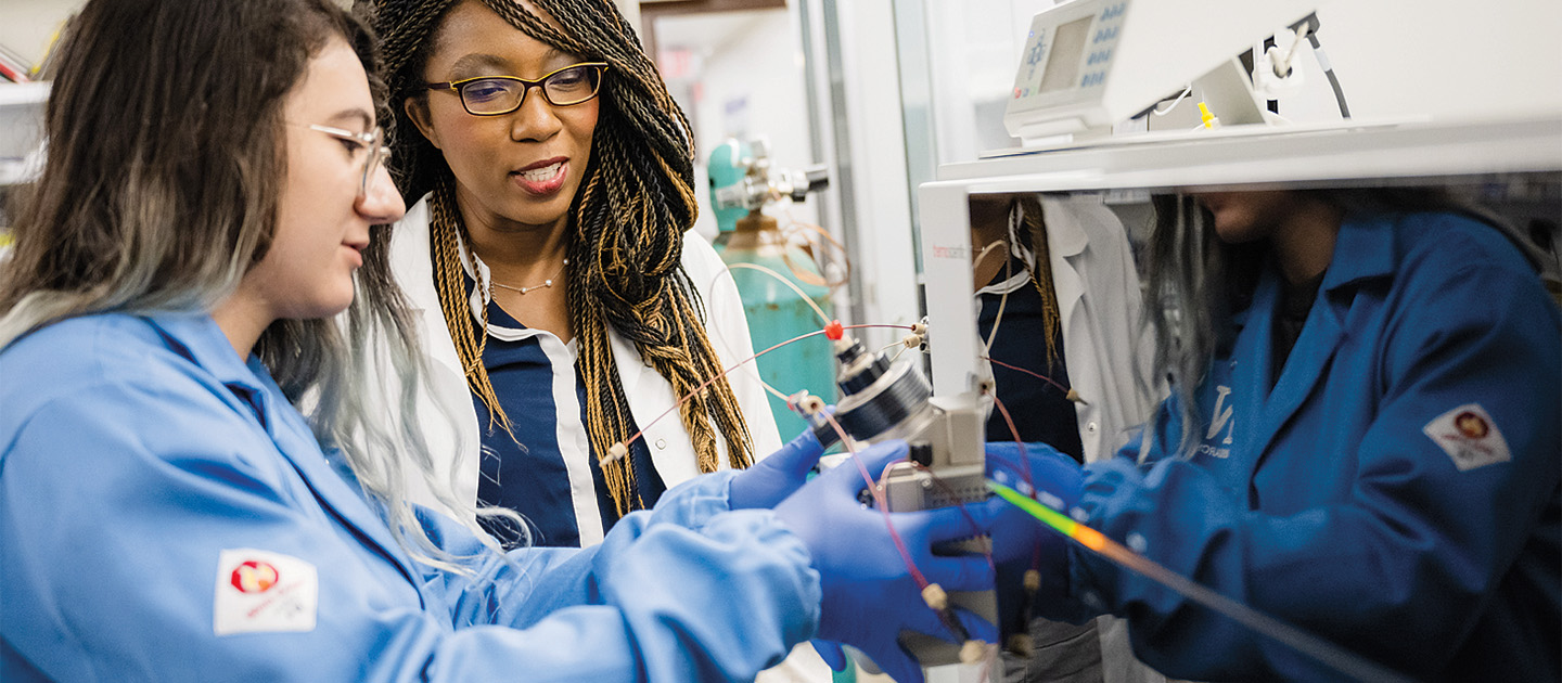 Professor Aristilde and researcher in her lab