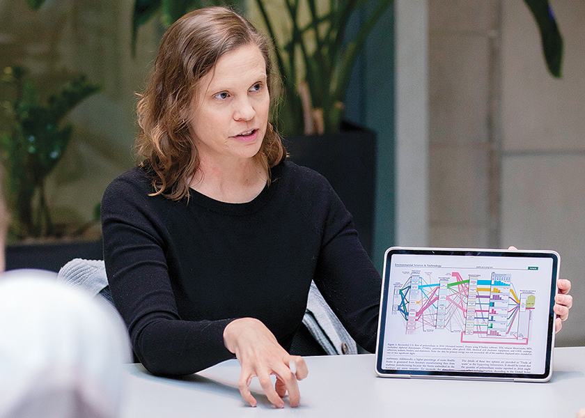 Jennifer Dunn holding an iPad with a chart