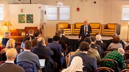 Speaker in front of a conference crowd