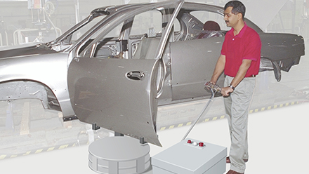 Cobot place under a car frame.